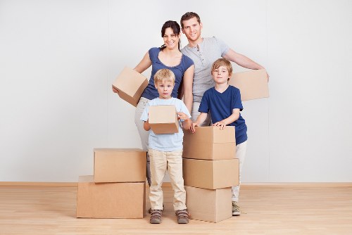 Commercial relocation with desks, boxes, and IT equipment