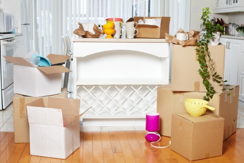 Local furniture pick-up service loading items from a residential property