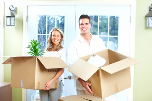 Office relocation planning with labelled boxes and workspace equipment